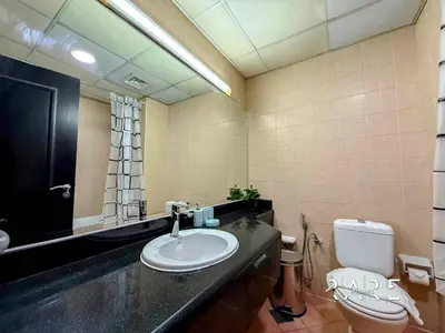 a bathroom with a sink and a toilet at Rare Holiday Homes - Mediterranean Cluster - Near Metro - Discovery Garden - Building# Med 83 - R105 in Dubai