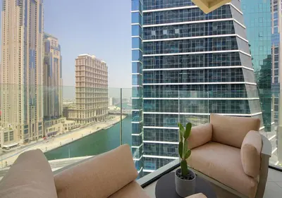 a living room with a view of a city at Luxury 2BR in Urban Oasis by Missoni on High Floor in Dubai