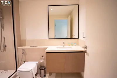 a bathroom with a sink and a mirror at Burj Crown Luxury 2BR W Balcony & Pool View 8th Floor in Dubai