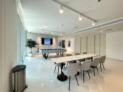 a room with a ping pong table and a pool table at Elegant & Luxurious 1BR Apartment in Beach Isle in Dubai