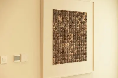 a painting in a white frame on a wall at Seraya Residence 5 - 4BDR - Burj Views - Private Jacuzzi in Dubai