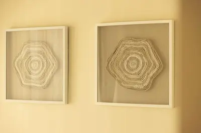 two framed photographs of a shell on a wall at Seraya Residence 5 - 4BDR - Burj Views - Private Jacuzzi in Dubai