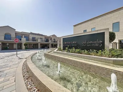 a building with a stop sign in front of it at Elegant - Three Bed Villa in Jumeirah Golf Estate in Dubai