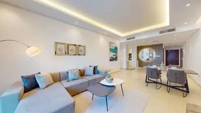 a living room with a couch and a table at Vacationer I Elegant 2 Bed I City View I Close to Barasti Beach I Marina Heights in Dubai