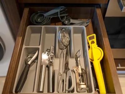a tray filled with utensils in a drawer at The Dubai Mall Suite Luxury 1-Bed Near Burj Khalifa in Dubai