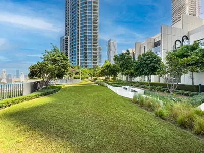 a park in the city with tall buildings at The Dubai Mall Suite Luxury 1-Bed Near Burj Khalifa in Dubai
