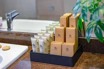 a bunch of candles in a tray in a bathroom at Luxury 2BR Haven with Expansive Terrace and Elegance in Dubai