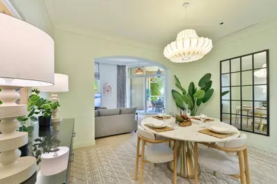 a living room with a table and a couch at Breathtaking 1BR Sea-View Palm Apt Beach & Pool in Dubai
