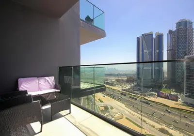 a balcony with a view of a city with traffic at Elegant Studio in Binghatti Canal Near Dubai Mall in Dubai