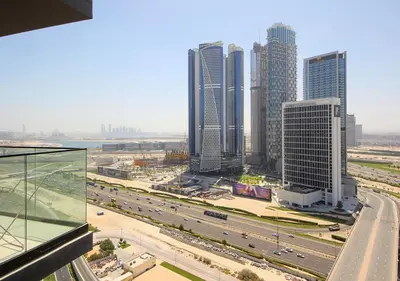 a view of a city with tall buildings and a highway at Elegant Studio in Binghatti Canal Near Dubai Mall in Dubai