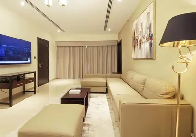 a living room with a couch and a table at 2BR Chic Elite Suite in Downtown near Dubai Mall in Dubai