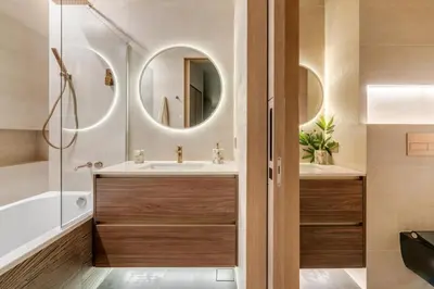 a bathroom with a tub and a sink and a mirror at ADDRESS Residences by Happy Season in Dubai