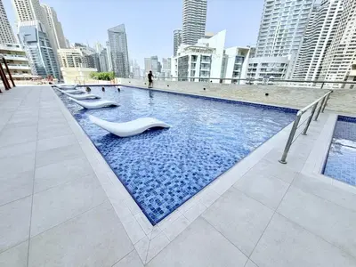 a swimming pool in a city with tall buildings at LivWithUs-Studio in One BR Setup, Dubai Marina in Dubai