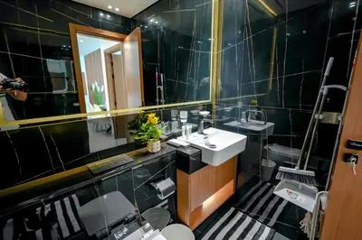 a bathroom with a sink and a mirror at Bright 1BR in Binghatti House, Prime Location in Dubai