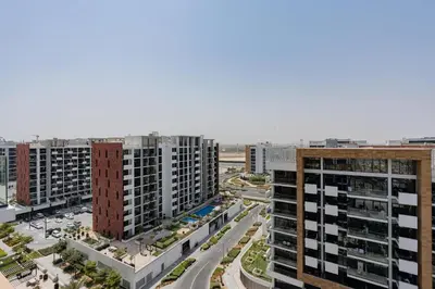 an aerial view of a city with tall buildings at TRPS - Azizi Riviera 23, Al Meydan - 2BR Elegant Apartment with Access to Premium Amenities in Dubai