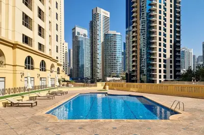 a swimming pool in a city with tall buildings at Ain Vista - Rimal 5 - JBR in Dubai