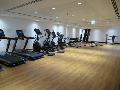 a gym with a bunch of treadmills and exercise bikes at Frank Porter - Midtown By Deyaar - Dania 2 in Dubai