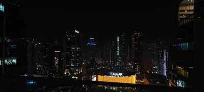 a view of a city skyline at night at JLT 1BR Marina Skyline View in Dubai