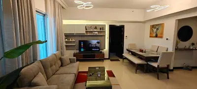 a living room with a couch and a dining room at JLT 1BR Marina Skyline View in Dubai
