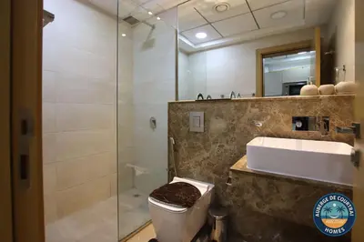 a bathroom with a toilet and a sink and a shower at Modern Studio Fully Furnished Oxford Residence in Dubai