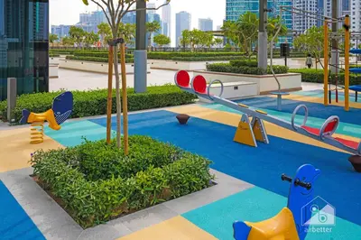 a childrens playground with a slide and swings at Full Luxury at Burj Crown 2B with City Views in Dubai