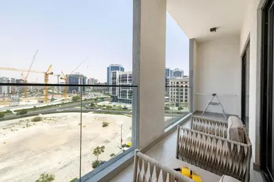 a balcony with a view of a city at New 1BR with Full Balcony Gym Pool and Sauna in Dubai
