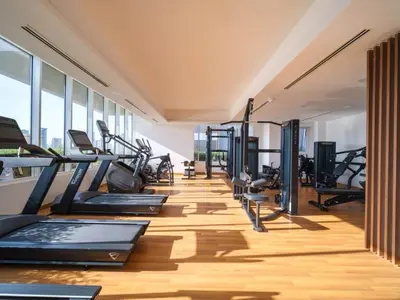 a gym with treadmills and elliptical machines at Luxury JVC Studio in a Great Location in Dubai