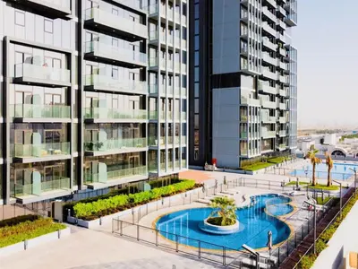 an apartment building with a pool in the middle at Luxury JVC Studio in a Great Location in Dubai