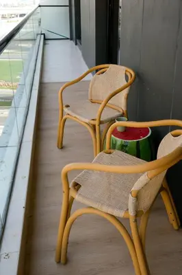 two chairs sitting on top of a balcony at 2 bedroom Apartment Dubai Marina in Dubai