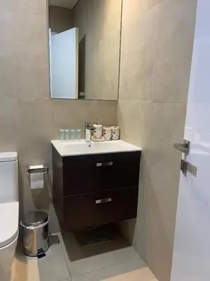 a bathroom with a sink and a toilet at Dubai Marina Sea View hotel Apartment in Dubai