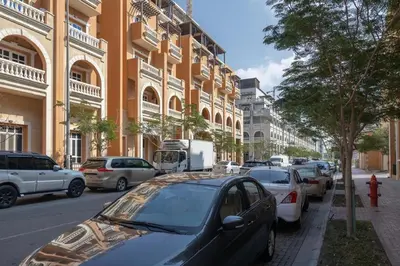 a group of cars parked on a city street at Retro House in Dubai