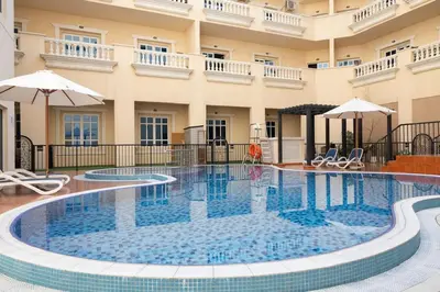 a swimming pool in the middle of a building at Retro House in Dubai