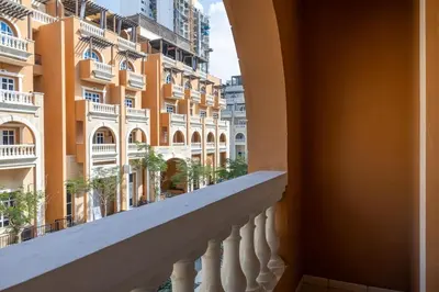 a balcony with a view of a building at Retro House in Dubai