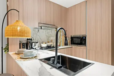 a kitchen with a sink and a counter top at FIRST CLASS Studio Contemporary Living in JVT in Dubai