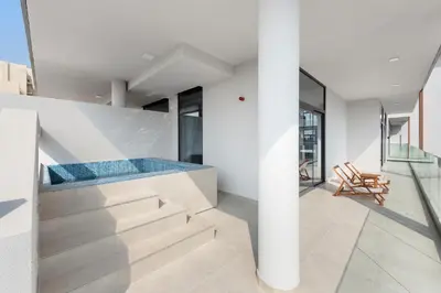 a house with a swimming pool on the top of the stairs at Vayk - Modern 2BR with Private Plunge Pool in JVC in Dubai