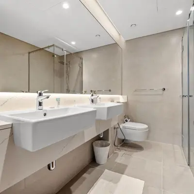 a bathroom with a sink and a toilet at Luxury Canal View-2BR Maid's Room in CF 2, Al Wasl in Dubai