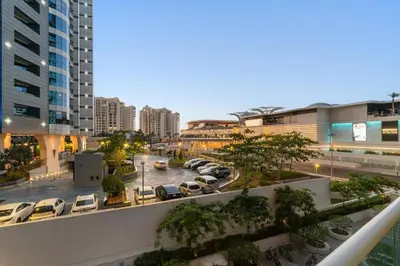 a view of a city with cars parked in a parking lot at FIRST CLASS Studio Palm Paradise in Dubai