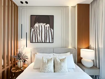 a bedroom with a bed with white pillows at Luxe Living in the Heart of Bbay w Jacuzzi in Dubai