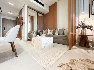 a living room with a couch and a table at Luxe Living in the Heart of Bbay w Jacuzzi in Dubai