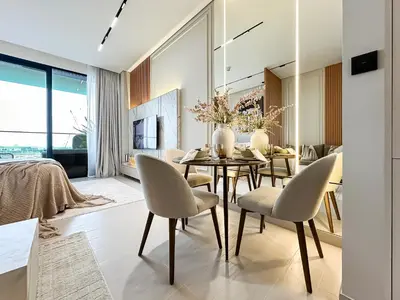 a dining room with a table and chairs at Luxe Living in the Heart of Bbay w Jacuzzi in Dubai