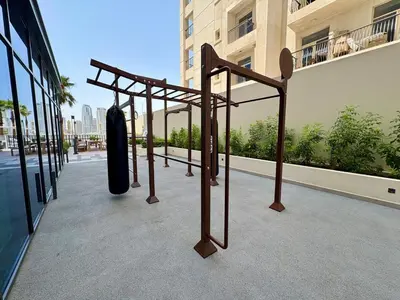 a group of objects on the side of a building at Stylish Studio in JVC with Pool, Gym, Balcony & Modern Comforts in Dubai