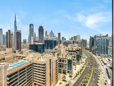 an aerial view of a city with tall buildings at Exclusive 1BD with Burj View & Private Jacuzzi in Dubai