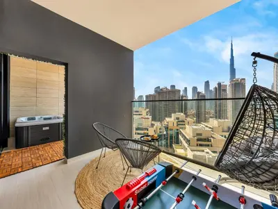 a living room with a view of the city at Chic 1BR Burj Khalifa Views Private Jacuzzi in Dubai