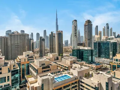 an aerial view of a city with tall buildings at Chic 1BR Burj Khalifa Views Private Jacuzzi in Dubai