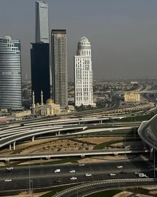a city with a highway and many buildings and cars at The Manchester JBR Marina Apartment Private Room with shared washroom in Dubai