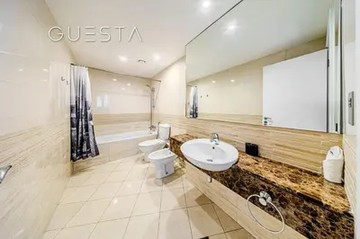 a bathroom with a toilet and a sink at Trident Grand Residence 1 BDR plus Guest Bedroom, Dubai Marina in Dubai