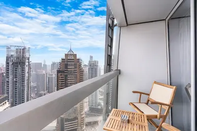 a balcony with a view of the city at 44th Floor Home at Cayan Tower with Panoramic Views in Dubai
