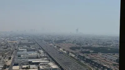an aerial view of a city with traffic at Aykon city in Dubai