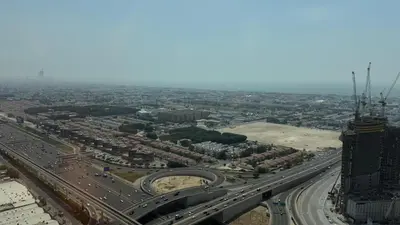 an aerial view of a city with a highway at Aykon city in Dubai