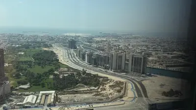 an aerial view of a city with buildings and roads at Aykon city in Dubai